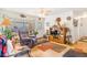 Cozy living room with ample natural light, hardwood floors, and a comfortable seating area at 5085 E Missouri Ave, Denver, CO 80246