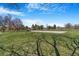 Scenic park view with lush green grass and mature trees under a blue sky at 5085 E Missouri Ave, Denver, CO 80246