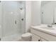 Bathroom featuring a glass shower with subway tiles, a white vanity, and modern fixtures at 5253 Cherry Blossom Dr, Brighton, CO 80601