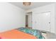 Stylish bedroom with closet, neutral walls, and bright textiles on the bed at 5253 Cherry Blossom Dr, Brighton, CO 80601