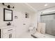 Bathroom featuring modern toilet, vanity with mirror, and roughed-in shower area at 3922 W 29Th Ave, Denver, CO 80212