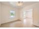 Cozy bedroom with natural light, laminate flooring, and an open doorway to the next room at 3922 W 29Th Ave, Denver, CO 80212
