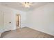 Clean bedroom with fresh paint, laminate flooring, ceiling fan, and white doors at 3922 W 29Th Ave, Denver, CO 80212