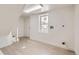 Laundry room with modern plumbing, electric, door to exterior, and large window bringing in natural light at 3922 W 29Th Ave, Denver, CO 80212