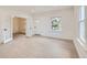 Spacious, bright living room featuring new laminate floors, fresh white paint, and ample natural light at 3922 W 29Th Ave, Denver, CO 80212