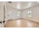Clean living room featuring new laminate floors, fresh white paint, new doors, and ample natural light at 3922 W 29Th Ave, Denver, CO 80212