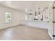 Spacious, bright living room featuring new laminate floors, fresh white paint, and open access to the modern kitchen at 3922 W 29Th Ave, Denver, CO 80212