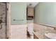 Cozy bathroom featuring granite counters, tiled shower, and tiled walls at 6259 S Fenton Ct, Littleton, CO 80123