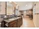 Elegant bathroom with dual sinks, granite countertop, and walk-in closet shelving at 6259 S Fenton Ct, Littleton, CO 80123