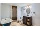 Finished basement bathroom with stand alone tub and stylish vanity at 6259 S Fenton Ct, Littleton, CO 80123