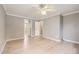 Bedroom featuring light wood floors, a ceiling fan, and white trim at 6259 S Fenton Ct, Littleton, CO 80123