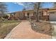 A brick pathway leads to the front entrance of this home at 6259 S Fenton Ct, Littleton, CO 80123