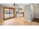 Bright living room with hardwood floors, sliding glass door, and eat-in kitchen at 6259 S Fenton Ct, Littleton, CO 80123