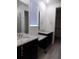 Bathroom featuring double vanities, granite countertops and updated fixtures, creating a bright and modern space at 1154 E Witherspoon Dr, Elizabeth, CO 80107