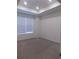 Bright bedroom with large window, neutral carpet, and ample natural light for a cozy atmosphere at 1154 E Witherspoon Dr, Elizabeth, CO 80107