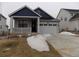 Charming single-Gathering home featuring a covered front porch and attached two-car garage at 1154 E Witherspoon Dr, Elizabeth, CO 80107