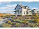 Charming historic home with a landscaped yard, stone steps, and porch at 1154 E Witherspoon Dr, Elizabeth, CO 80107