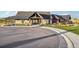 Exterior of the community clubhouse, featuring landscaped grounds and sidewalks at 1154 E Witherspoon Dr, Elizabeth, CO 80107