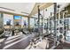 Community gym featuring treadmills, weight lifting equipment, and mounted TVs at 1154 E Witherspoon Dr, Elizabeth, CO 80107