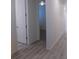 Bright hallway featuring modern flooring and a view into adjacent rooms at 1154 E Witherspoon Dr, Elizabeth, CO 80107