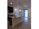 Open kitchen featuring a large island, stainless steel appliances, and contemporary finishes at 1154 E Witherspoon Dr, Elizabeth, CO 80107