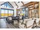 Stunning living room with vaulted ceilings, large windows, and stylish decor at 1154 E Witherspoon Dr, Elizabeth, CO 80107