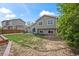 Spacious backyard with a well-maintained lawn and a patio area at 11296 Daisy Ct, Firestone, CO 80504