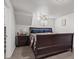 Cozy bedroom with a large bed, nightstand, and carpeted floors at 11296 Daisy Ct, Firestone, CO 80504