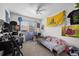 Eclectic bedroom with a small sofa, wall decor, and natural light at 11296 Daisy Ct, Firestone, CO 80504