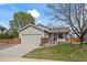 Inviting single-Gathering home featuring a two-car garage and attractive brick accents at 11296 Daisy Ct, Firestone, CO 80504