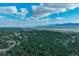 An aerial view of homes surrounded by mature trees at 17865 Smugglers Rd, Monument, CO 80132