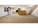 Spacious finished basement with a bar, kitchenette, and carpeted flooring at 17865 Smugglers Rd, Monument, CO 80132