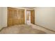 Bedroom featuring neutral carpet and wooden closet doors at 17865 Smugglers Rd, Monument, CO 80132