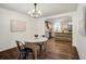 Open concept dining room with hardwood floors leading to modern kitchen at 17865 Smugglers Rd, Monument, CO 80132