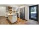 Modern kitchen features an island, stainless steel appliances, and hardwood floors at 17865 Smugglers Rd, Monument, CO 80132