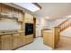 Small kitchenette area in basement features wooden cabinetry and ample counter space at 17865 Smugglers Rd, Monument, CO 80132