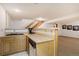 Basement kitchenette area with wooden cabinets, sink, and counter space at 17865 Smugglers Rd, Monument, CO 80132