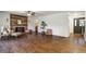Open-concept living room with hardwood floors, a modern fireplace, and an abundance of natural light at 17865 Smugglers Rd, Monument, CO 80132