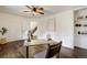Bright home office with hardwood floors, built-in shelves, and natural light at 17865 Smugglers Rd, Monument, CO 80132