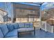 Covered back deck featuring comfortable cushioned seating at 2649 Westgate Ave, Highlands Ranch, CO 80126