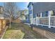 Side of house with back deck and grassy yard at 2649 Westgate Ave, Highlands Ranch, CO 80126