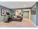 Spacious finished basement features plush carpet, neutral decor, and exercise area at 2649 Westgate Ave, Highlands Ranch, CO 80126