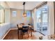 This dining room offers a modern light fixture and sliding glass doors to the outdoor seating area at 2649 Westgate Ave, Highlands Ranch, CO 80126