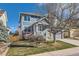 Charming two-story home with blue siding, stone accents, and a well-maintained lawn at 2649 Westgate Ave, Highlands Ranch, CO 80126