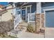 Cozy front porch with stone columns and a white wood railing, provides a welcoming entry at 2649 Westgate Ave, Highlands Ranch, CO 80126