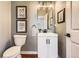 Stylish powder room features modern vanity, fixtures, and decor at 2649 Westgate Ave, Highlands Ranch, CO 80126