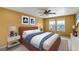 Bedroom featuring a ceiling fan, carpet, and a large bed with accompanying furnishings at 3429 Hardin St, Castle Rock, CO 80109