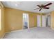 Primary bedroom with carpet, ceiling fan, closet, and ensuite bathroom at 3429 Hardin St, Castle Rock, CO 80109