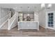 Modern kitchen with stainless steel appliances, white countertops, and stylish pendant lighting at 3429 Hardin St, Castle Rock, CO 80109