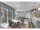 Bright living space features sleek, open-concept design, modern lighting, and beautiful wood floors at 3429 Hardin St, Castle Rock, CO 80109